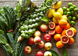 a group of fruits and vegetables on a wood surface Healthy Weight Loss Diets Sussex